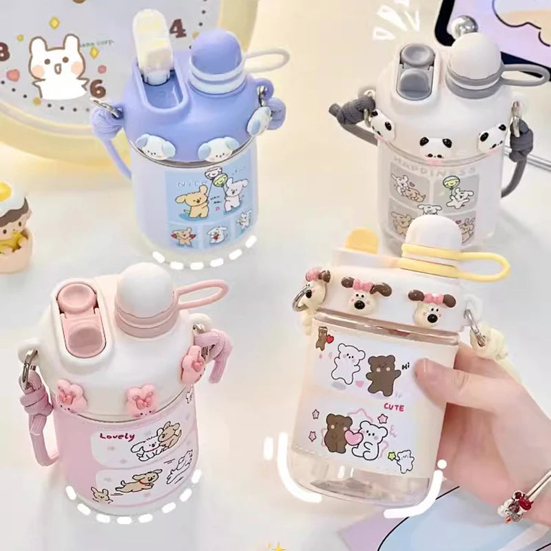 Four cute water bottles with cartoon designs on a light background