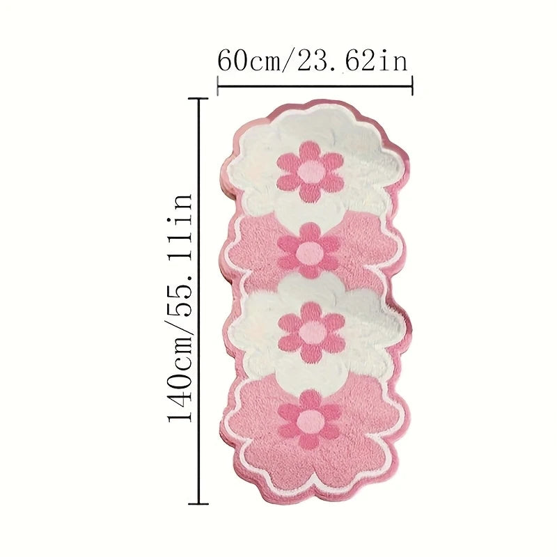 Pink and white floral bath mat with dimension markings showing 140cm in height and 60cm in width on a plain white background.