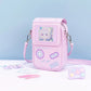 Pink game controller-shaped bag with a small pouch on a light blue background