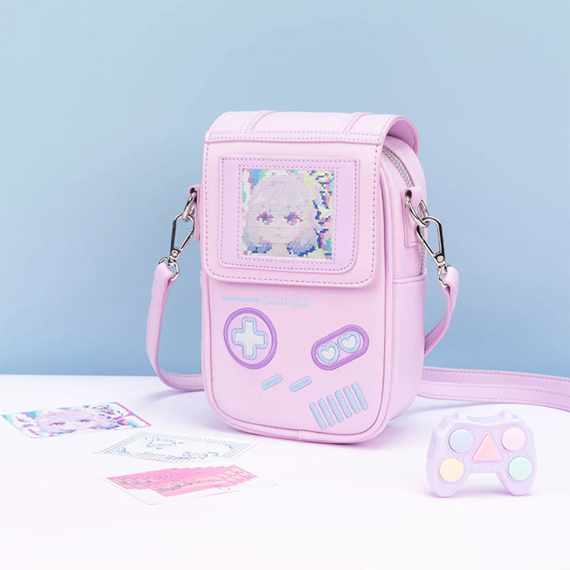 Pink game controller-shaped bag with a small pouch on a light blue background