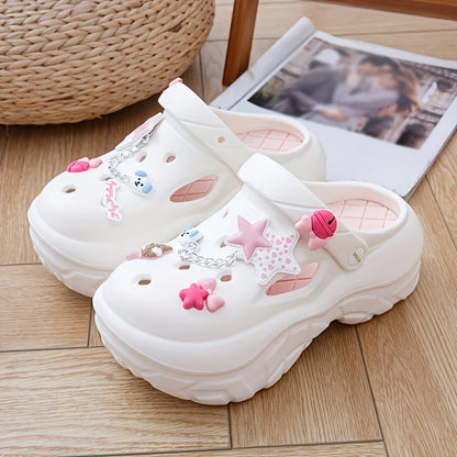 White sandals with stars and bows as decorative charms on a wooden floor