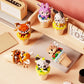 Kawaii ice cream building block animals displayed on a wooden table surface