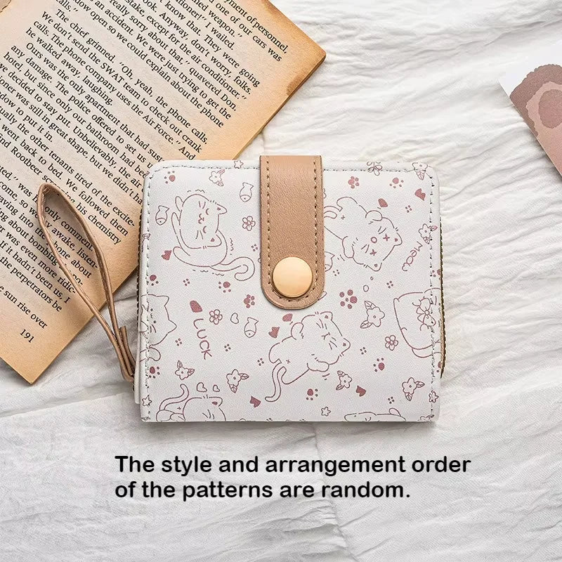 Small wallet with cat pattern on a textured surface