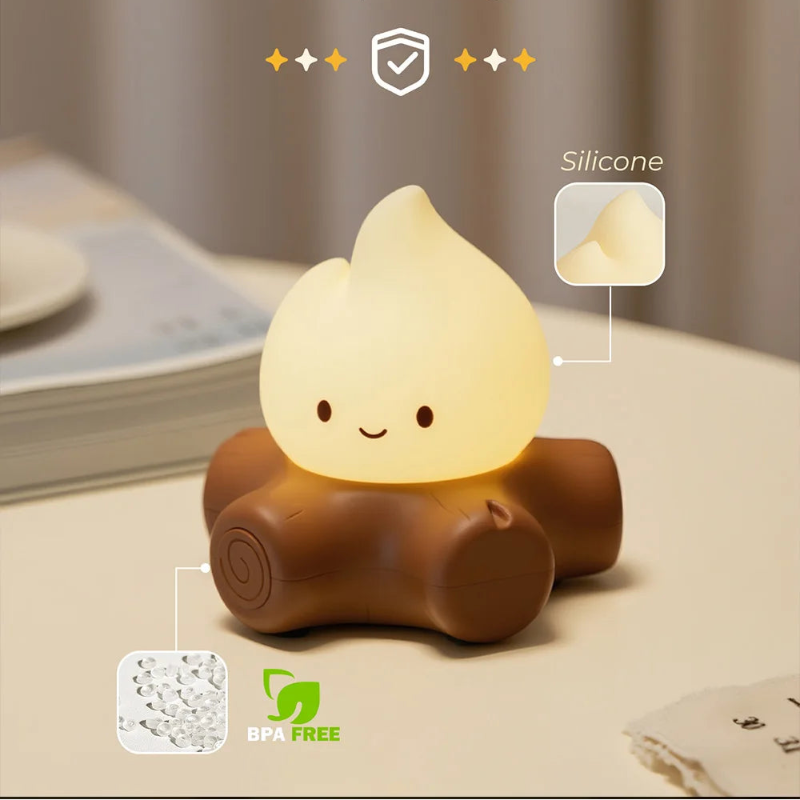 Silicone night light with a smiling face on a surface, labeled as BPA free.