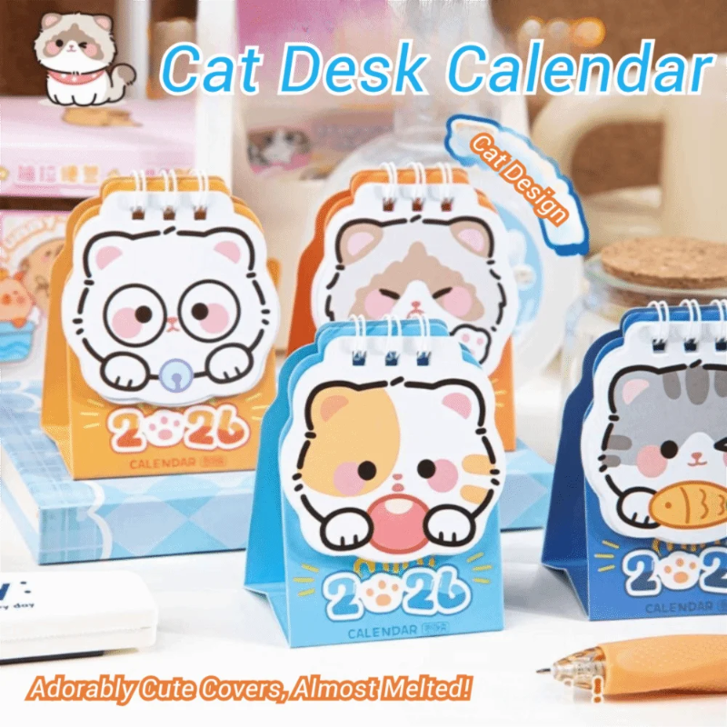 Set of cat-themed desk calendars with cute designs on a blurred background.