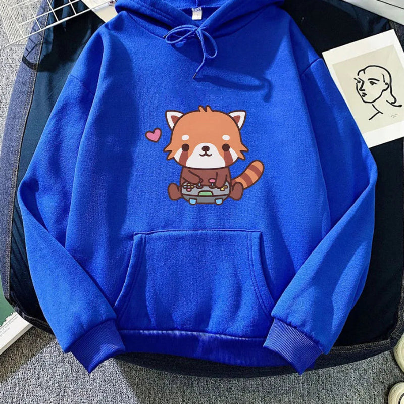 Blue hoodie with a red panda design on a textured surface