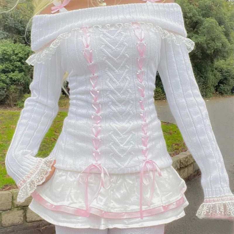 Front view of a Kawaii Coquette Off Shoulder Ribbon Sweater modeled by a woman in white 