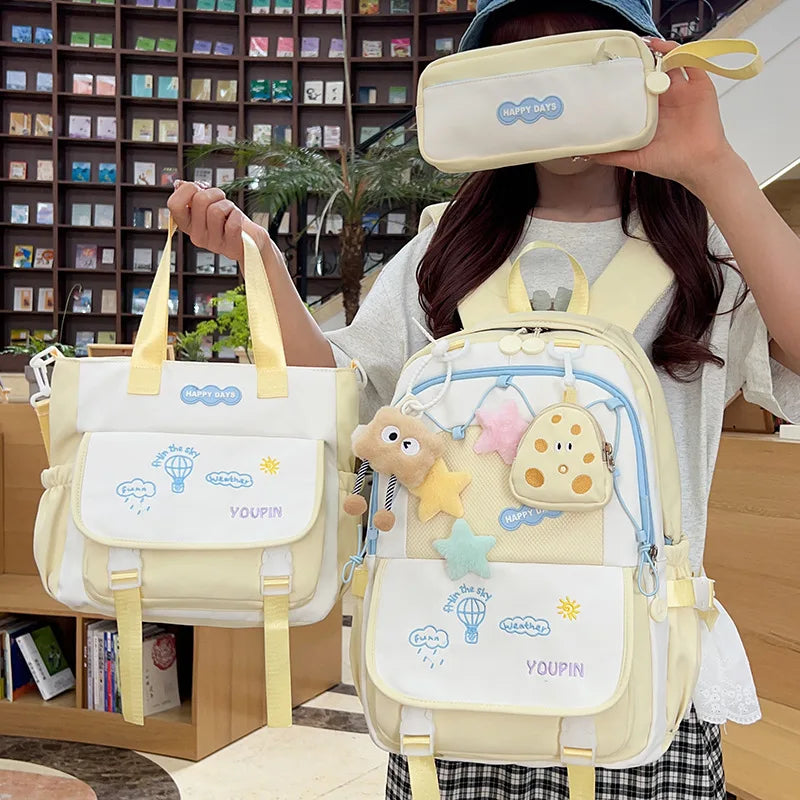 Happy days 3 piece kawaii backpack set, being displayed by person holding yellow version