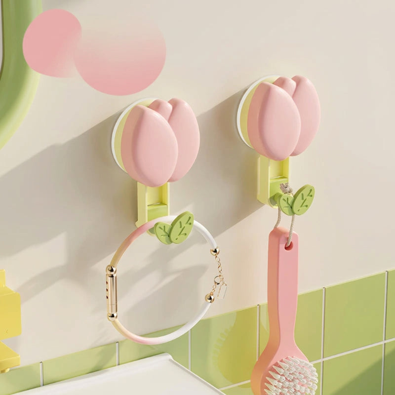 Pink and green petal hooks on a tiled wall with Dopamine branding.