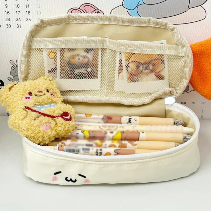 Pencil case with stationery items and a plush toy on a light background