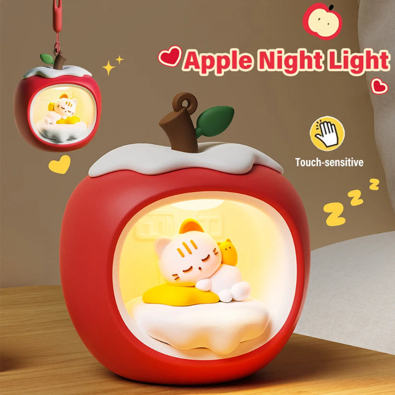 Red apple-shaped night light with cat sleeping inside.