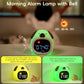 Front view of Kawaii Cute Puppy Night Light Alarm Clock in yellow and green colors showcasing morning alarm lamp with a bell 