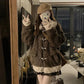 A woman takes a mirror selfie wearing a dark brown shaggy faux-fur jacket with cream faux-fur trim and toggle closures, along with a tan beret and brown boots in a modern indoor setting.
