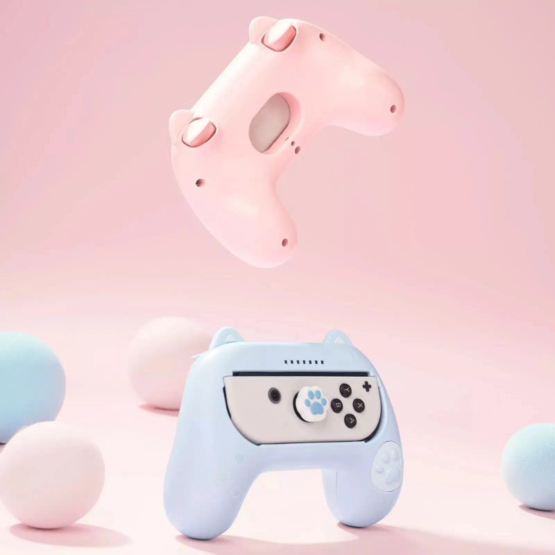 Pink and blue gaming controllers with animal-like design on a pink background