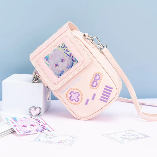 Pink game console-themed crossbody bag with a light blue background