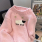 Front view of a Kawaii Little Lamb Sweater displayed on a chair