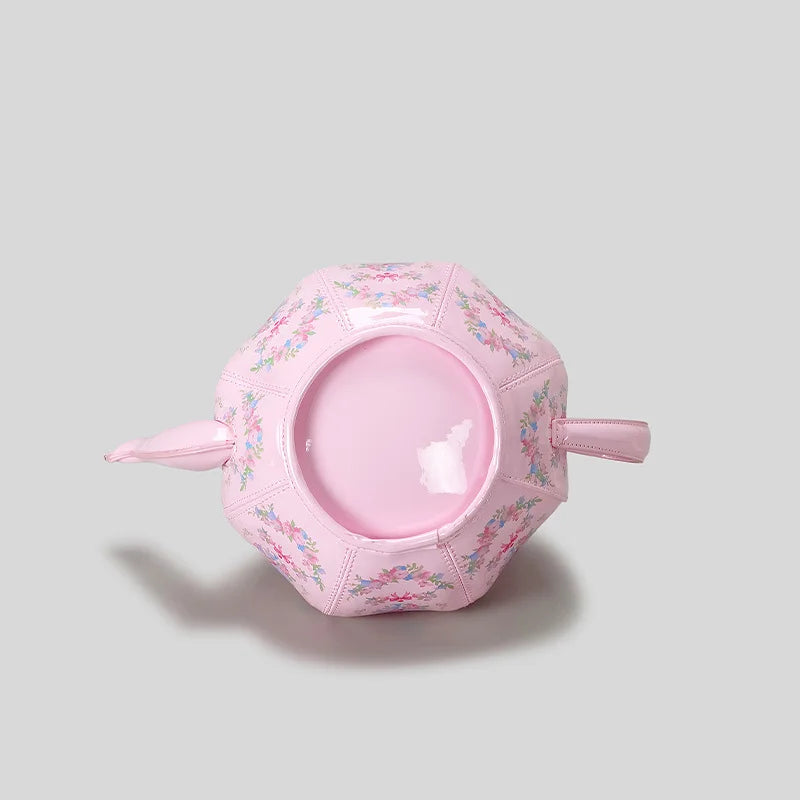 kawaii pink tea party bag on its side displaying bottom of bag on white background