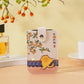 Pouch with cat design on a table with a blurred background