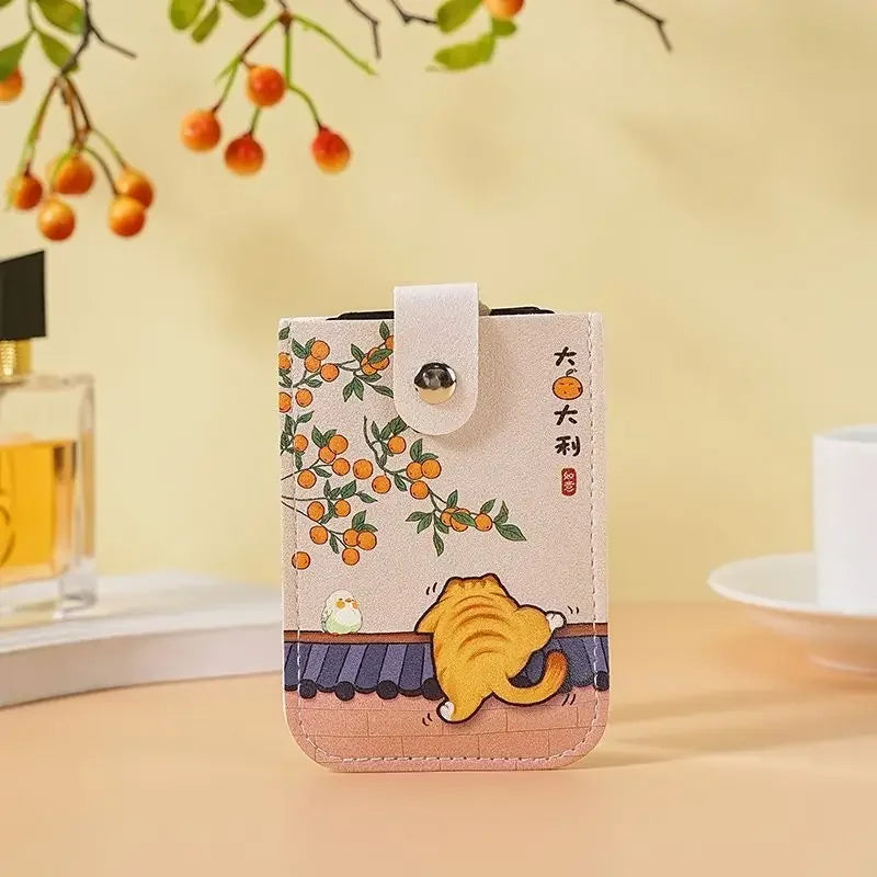 Pouch with cat design on a table with a blurred background
