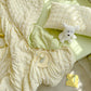 Green seersucker duvet set displayed on bed from above