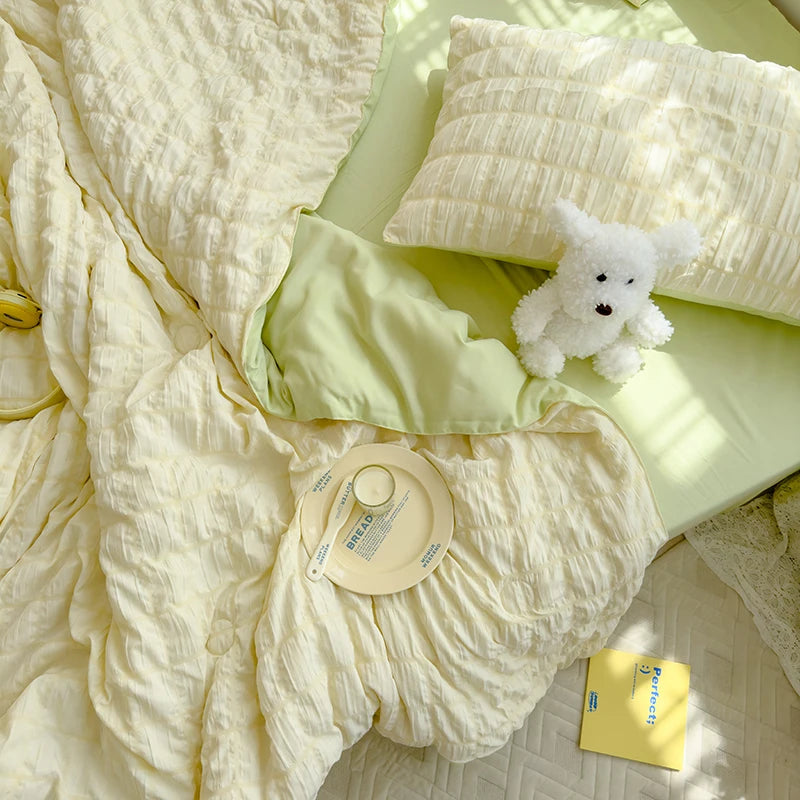 Green seersucker duvet set displayed on bed from above