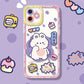 This design has a cute bunny placed in the middle of the phone case  with a purple paint splat behind, and a pink rim. 
