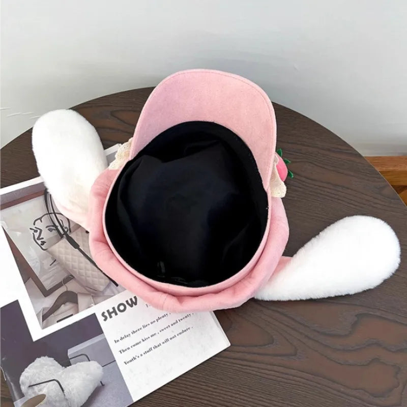 Pink bunny hat upside down on a wooden table