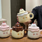Kawaii Animal Pudding Ceramic Mugs in multi colors  on a countertop 
