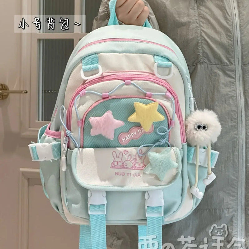 Kawaii Backpack with star design held by a person.