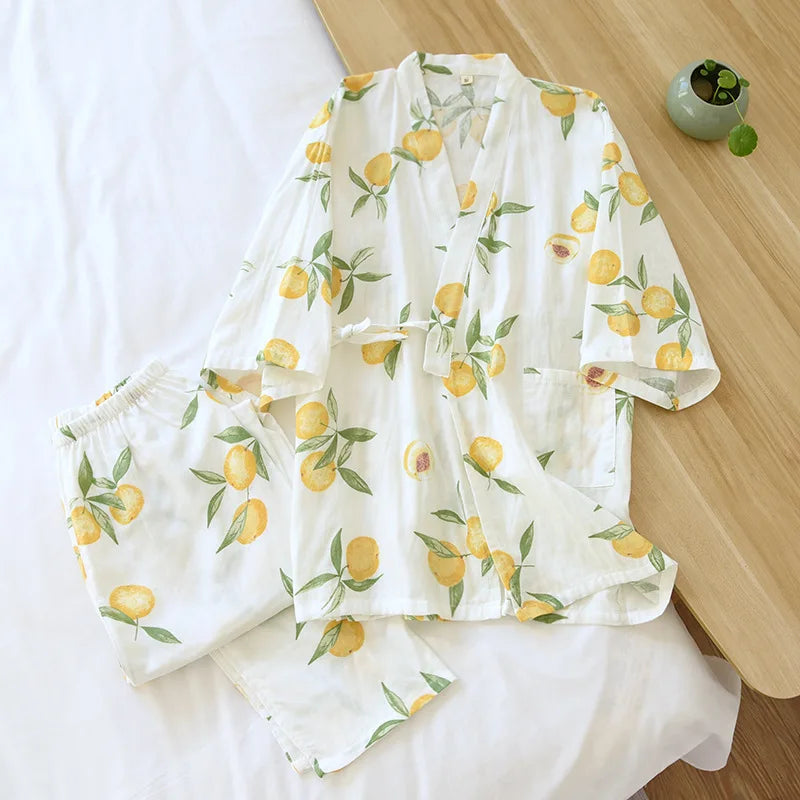 White outfit with lemon print on a wooden surface