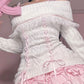 Front view of a Kawaii Coquette Off Shoulder Ribbon Sweater modeled by a woman in white 