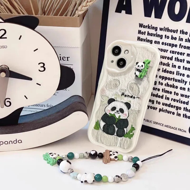 kawaii panda samsung white phone case with no ears , displayed with a panda sat down eating bamboo on the case with a beaded charm laid next to it against a worded poster background.