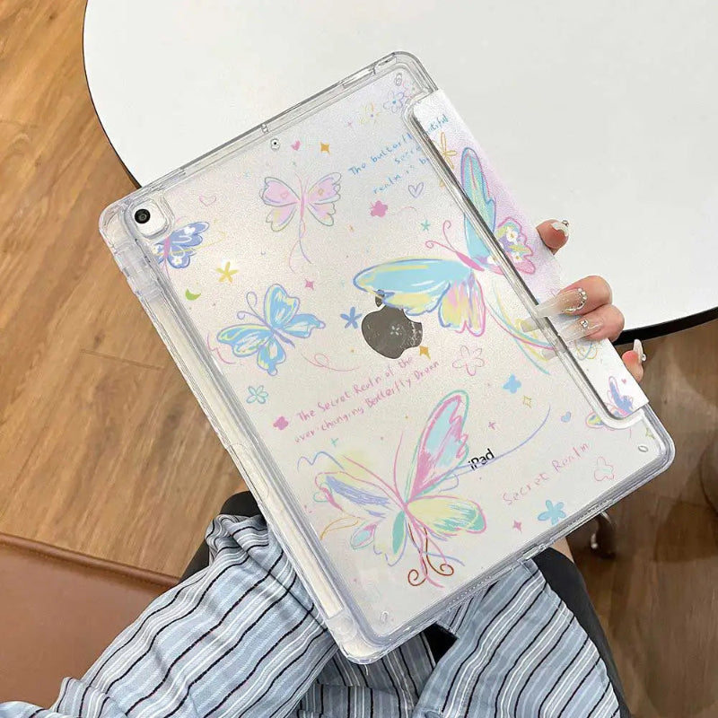 Person holding the ipad case with a colorful butterflies on a wooden background