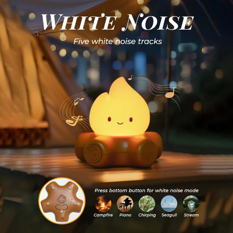 White noise machine with campfire design on a wooden surface at night.