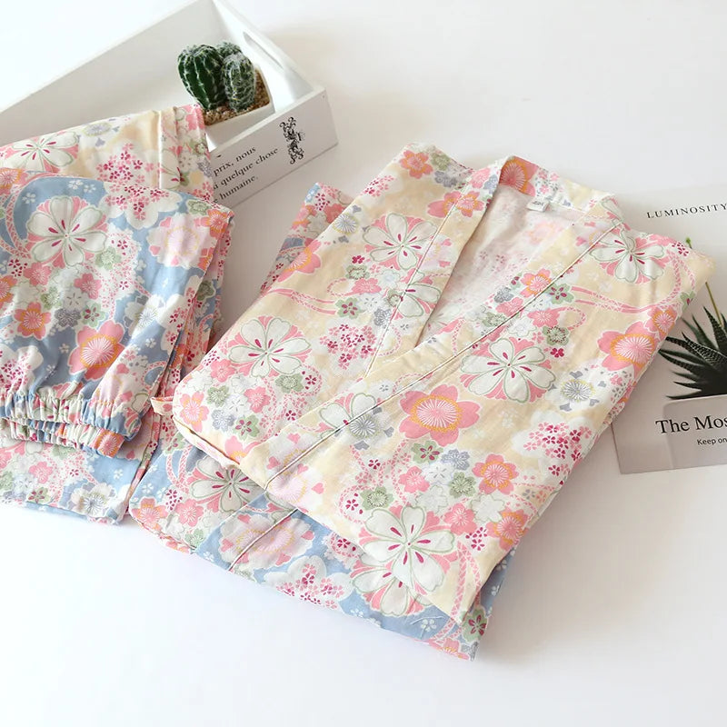 Floral-patterned fabric on a white surface with a cactus and books in the background