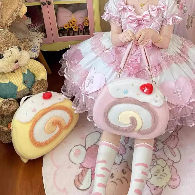 Person wearing a pink dress holding a pink swiss roll bag with the yellow one beside her.