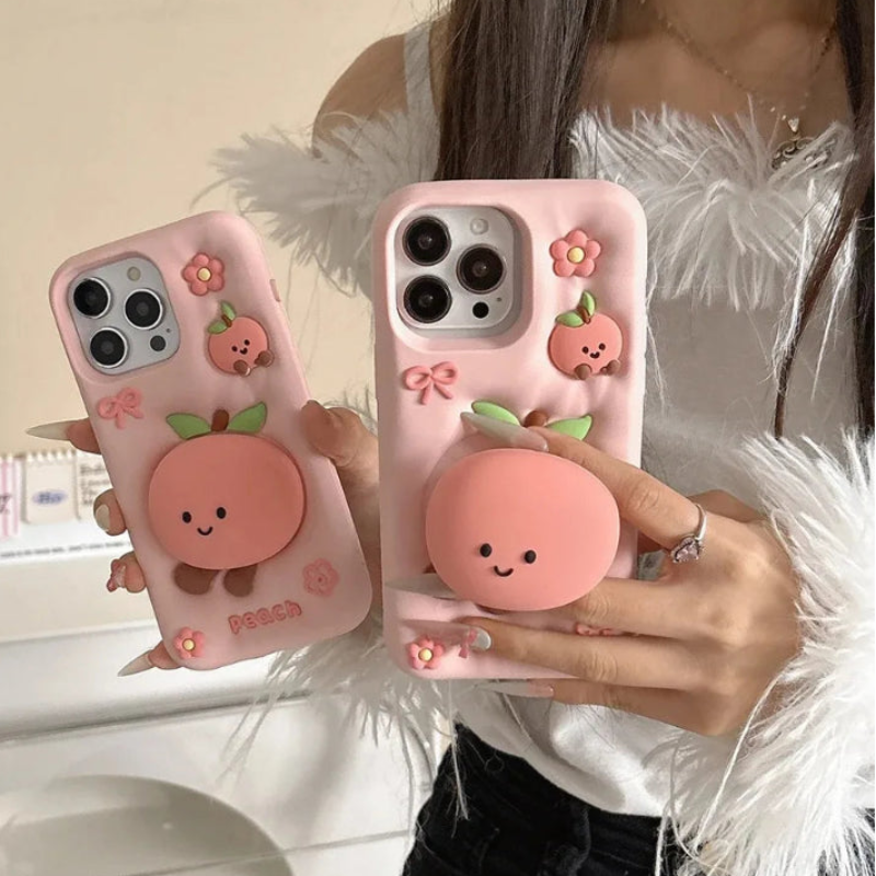 Rear view of Kawaii Peach iPhone Cases being held by a woman