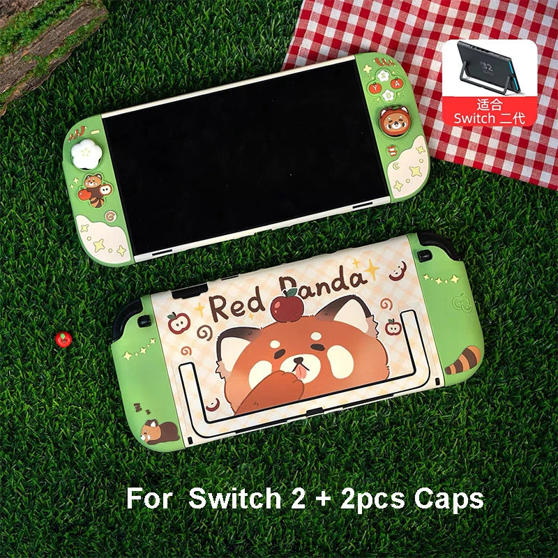 Two gaming consoles with cartoon designs on a grassy surface, one featuring a red panda.