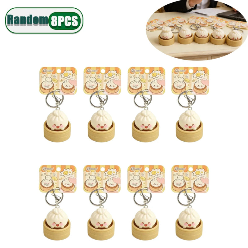 Set of eight small keychains with packaging on a white background