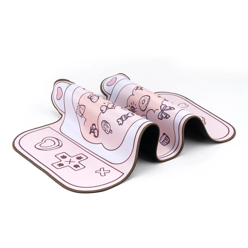 Pink and white slippers with cartoon designs on a white background