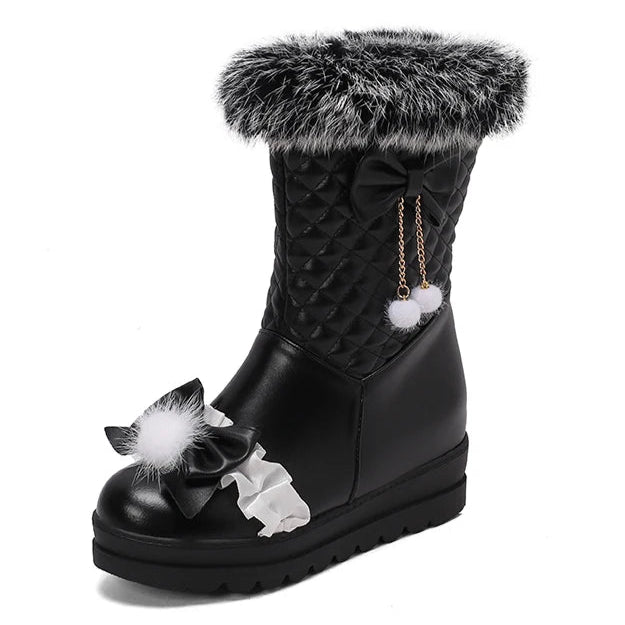 Black winter boot with fur trim and decorative elements on a white background