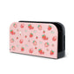 Pink gaming console cover with strawberry pattern on a white background
