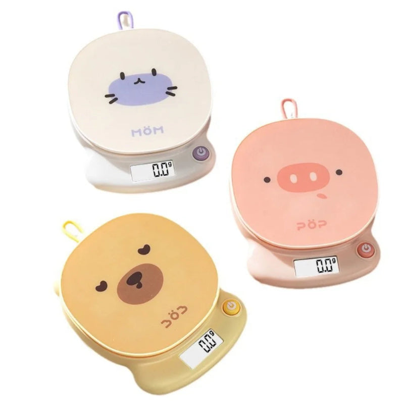 Three kawaii digital kitchen scales with animal faces on a white background.