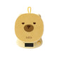 Yellow bear-shaped scale with a brown centre on a white background