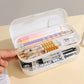 Pencil case with stationery items including pens and markers on a light surface.