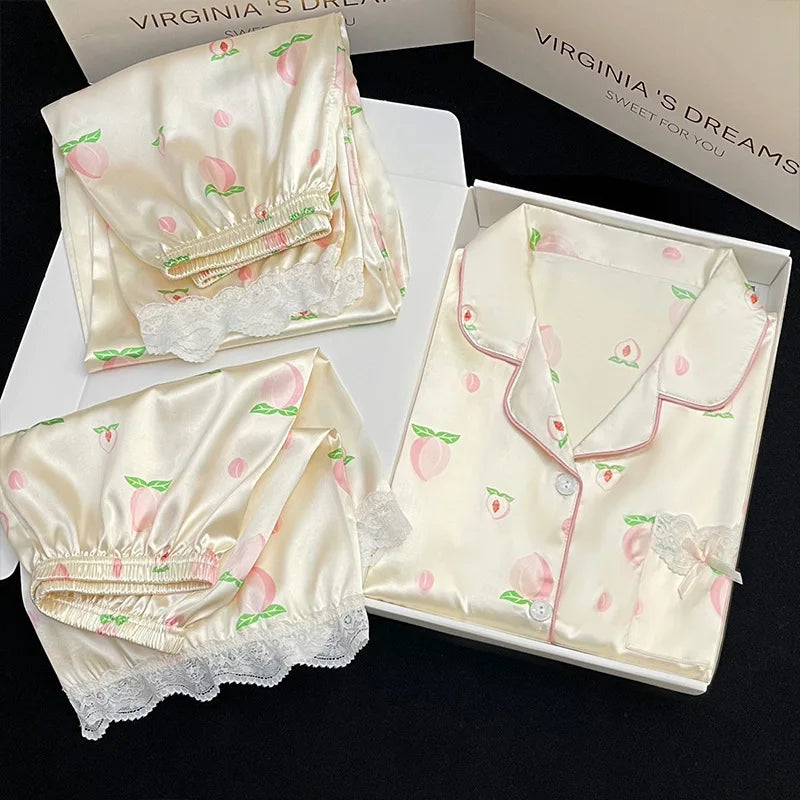 Cute Peach Print Lace Trim Pajamas, this is the bundle that contains the shorts and trousers to go with the pajama top. its displayed in a white box against a black background.