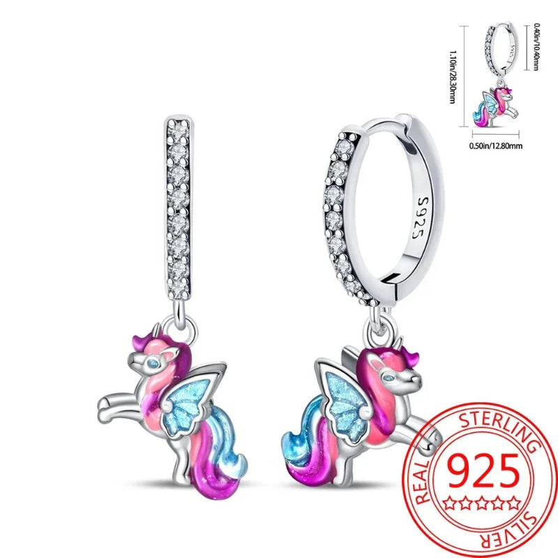 Unicorn-shaped earrings with 'Real Sterling 925' stamp on a white background