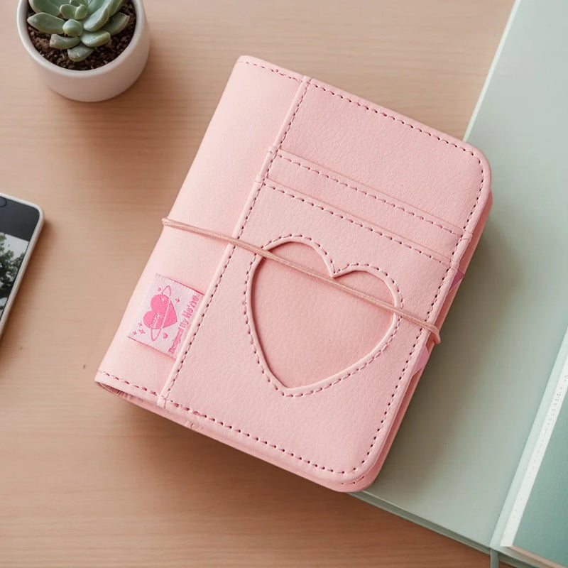 Pink PU Leather album with heart cutout on a plate