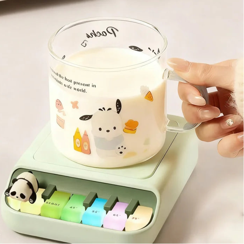 Green Kawaii Panda Piano Cup Heater held by a woman on a table