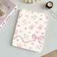 tablet case with teddy bear and bow pattern on a light surface